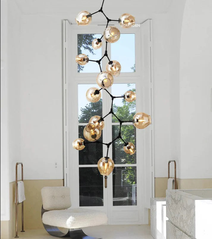 Ahuja international 11 Light Amber Glass Black Double Height Long Chandelier - Warm White